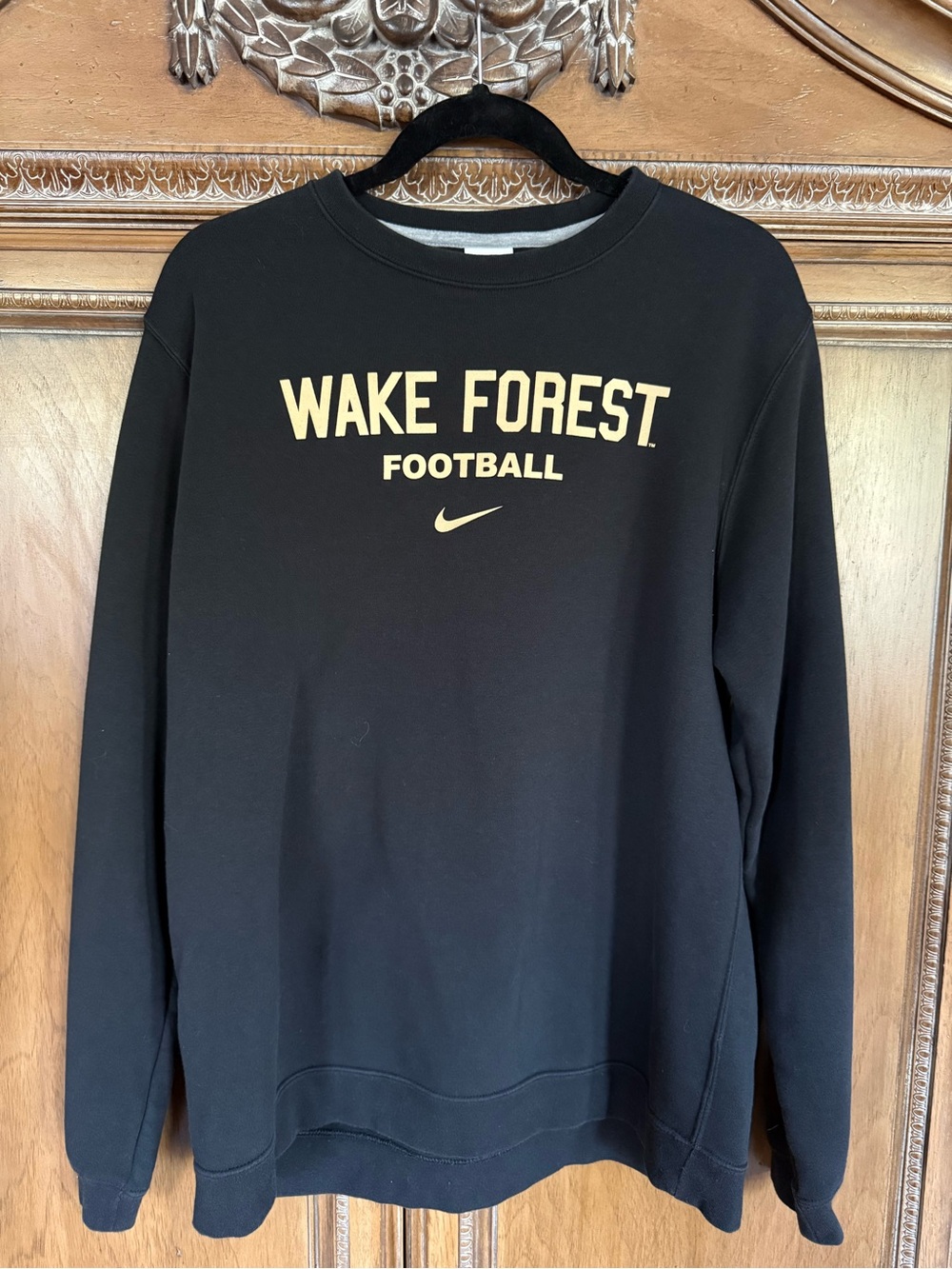 Nike Black Crewneck Sweatshirt with Gold Wake Forest Football Text